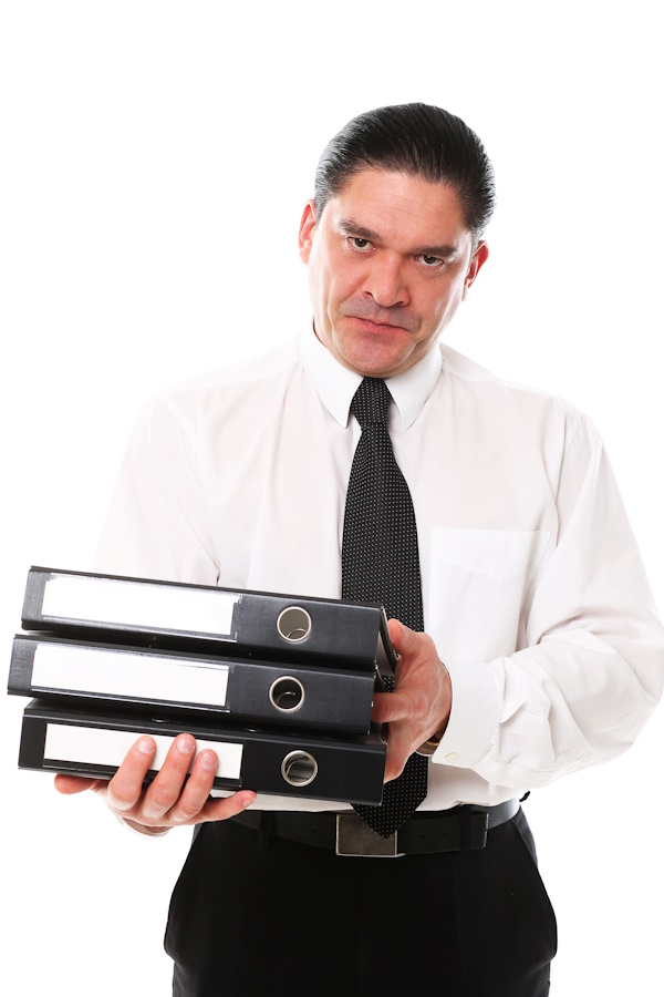 A picture of a man carrying physical folders